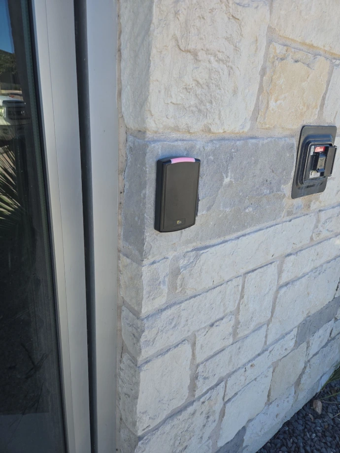 Card reader mounted on stone.